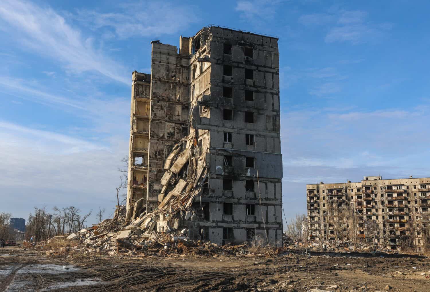 A residential building was destroyed by an explosion as a result of Russia's war against Ukraine. A residential building damaged burned down from the consequences of the fighting in Mariupol.