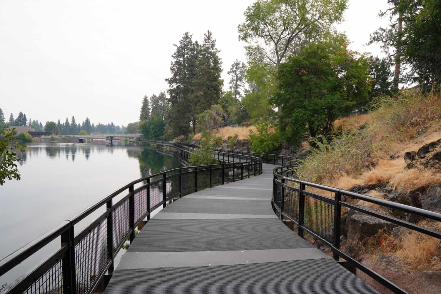 Walking path along the Deschutes River at Drake Park in Bend, Oregon
