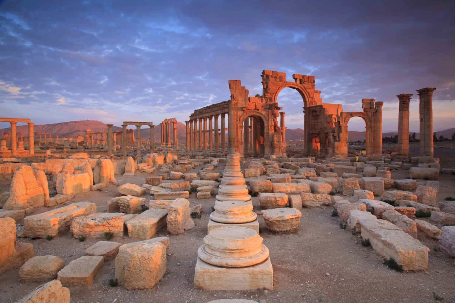 The Bel Temple in Palmyra, Syria, is an ancient architectural marvel. Majestic columns and intricate carvings adorn its facade, reflecting a blend of Roman and Semitic influences. The temple, dedicate