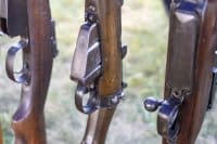 A close-up of the magazine and firing button of World War II rifles