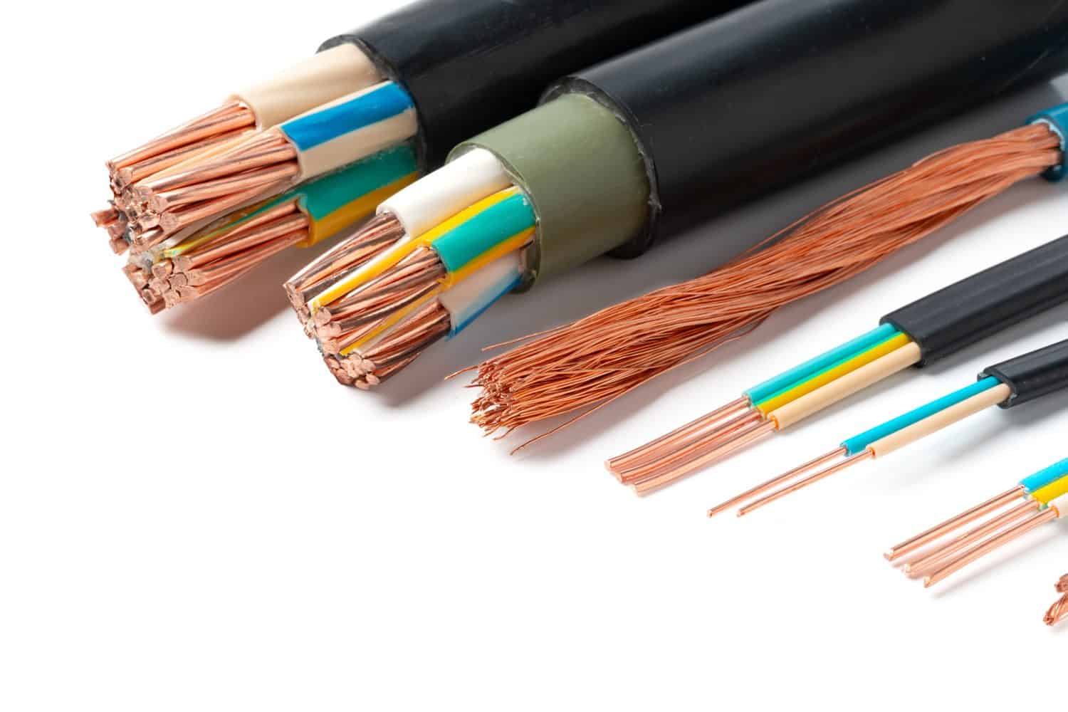 Various Electrical Wires With Exposed Copper Strands on White Background