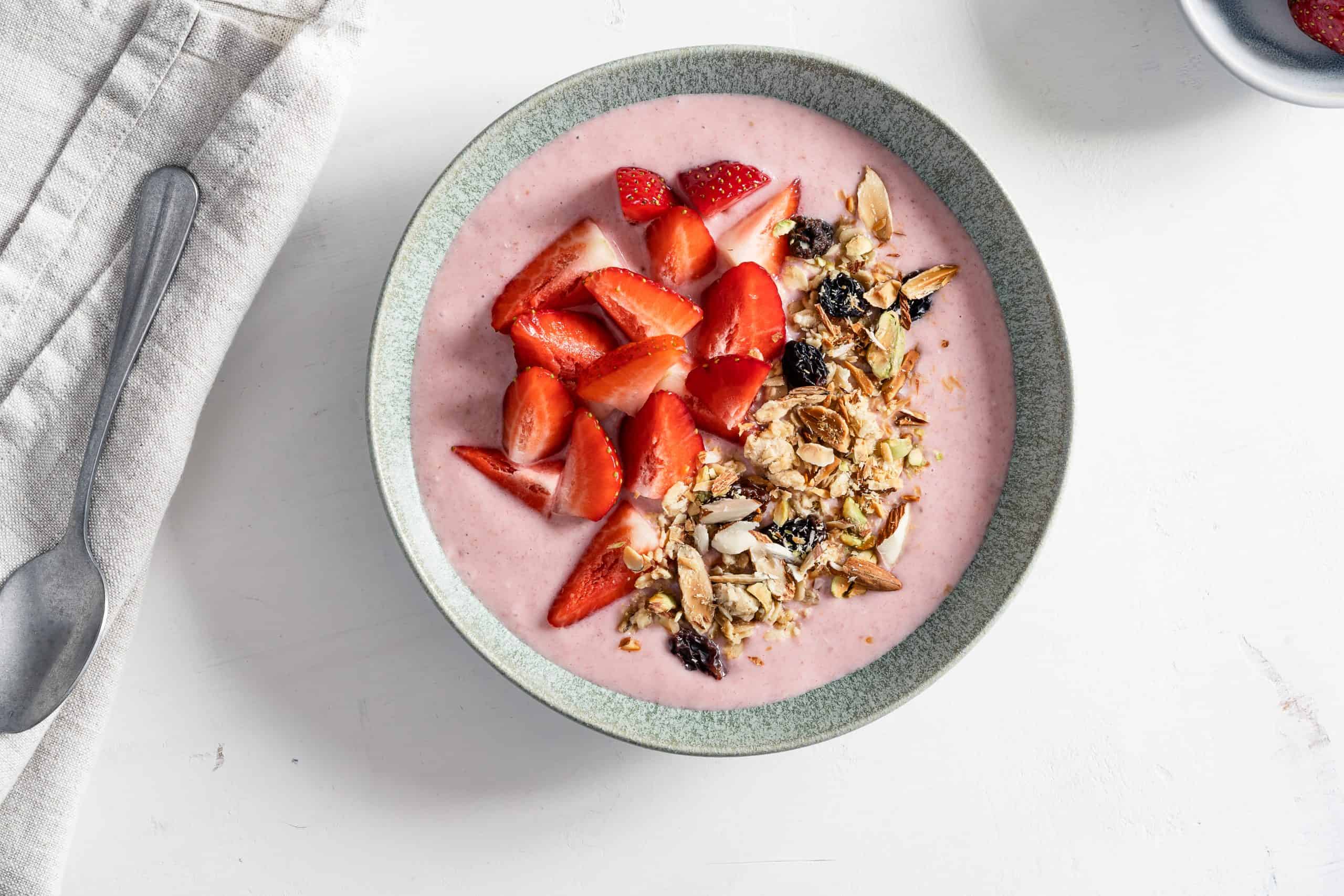 Strawberry smoothie bowl with granola, summer breakfast