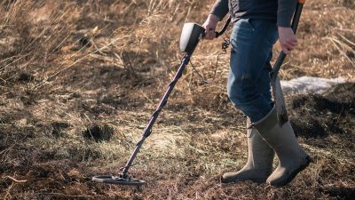 Person using metal detector