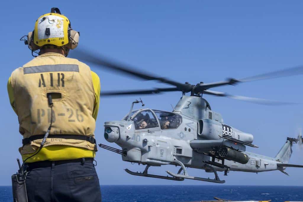 AH-1Z+Viper | A Sailor signals AH-1Z Viper helicopter pilots during exercise Eager Lion 2019.