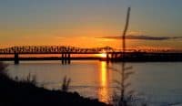 sunset at Memphis-Arkansas bridge over mississippi river