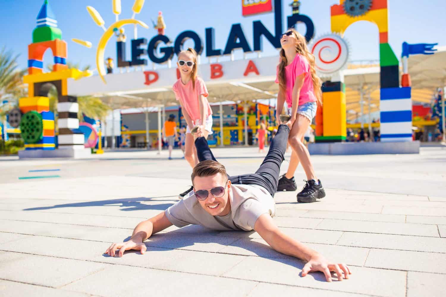 LEGOLAND DUBAI, FEBRUARY 19, 2020 - Dad fools around with the kids before going to Legoland at Dubai Parks and Resorts, Dubai, UAE