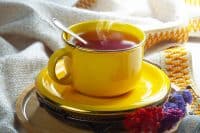 Sweet, hot tea with dessert, on an old background.