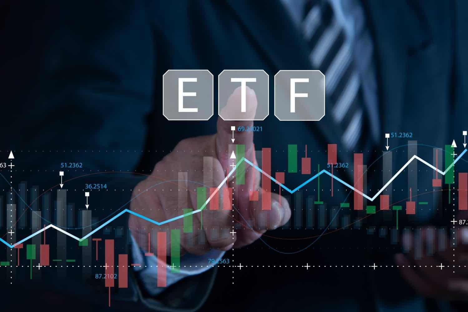 Businessman pointing to ETF (Exchange Traded Funds). Investment opportunities in mutual funds and ETFs, growth of wealth in the financial market.