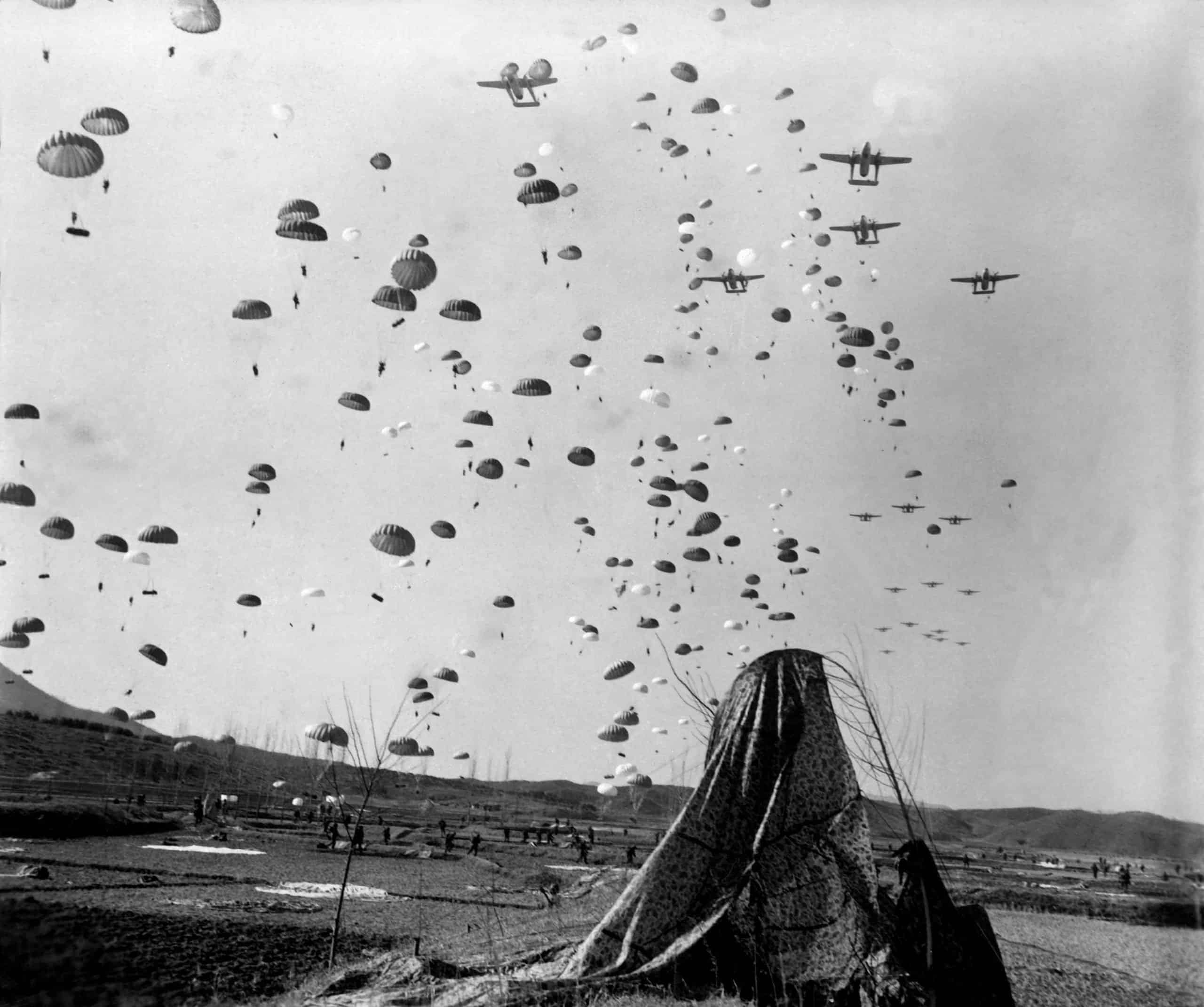 Paratroopers jump from C-119 over Korea.