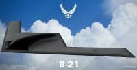 An artist rendering depicts a dark grey, stealth B-21 Raider bomber flying horizontally in a clear blue sky with fluffy white clouds. The white U.S. Air Force logo is centered at the top, and the text 'B-21' is prominent at the bottom center. Smaller text in the bottom right corner reads '*ARTIST RENDERING'.