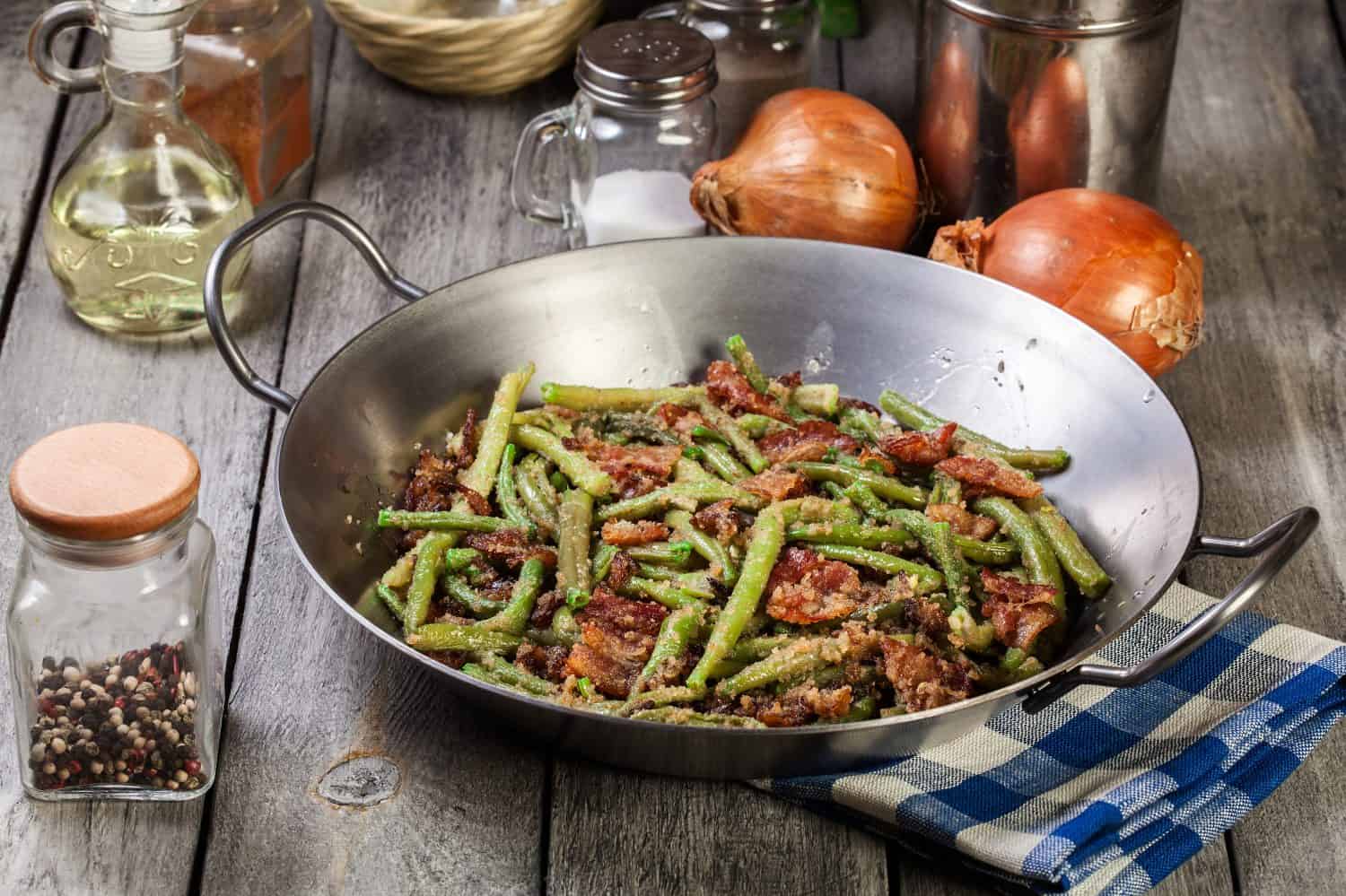 Healthy Sauteed Green Beans with Bacon, Onion, and Breadcrumbs in a Steel Pan