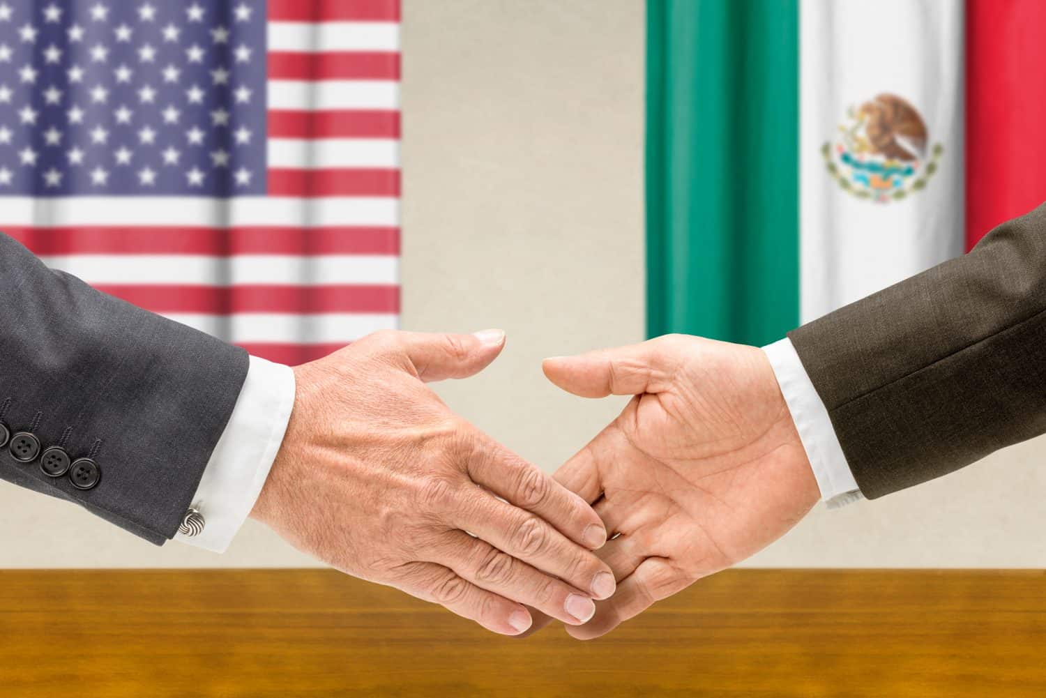 Representatives of the USA and Mexico shake hands