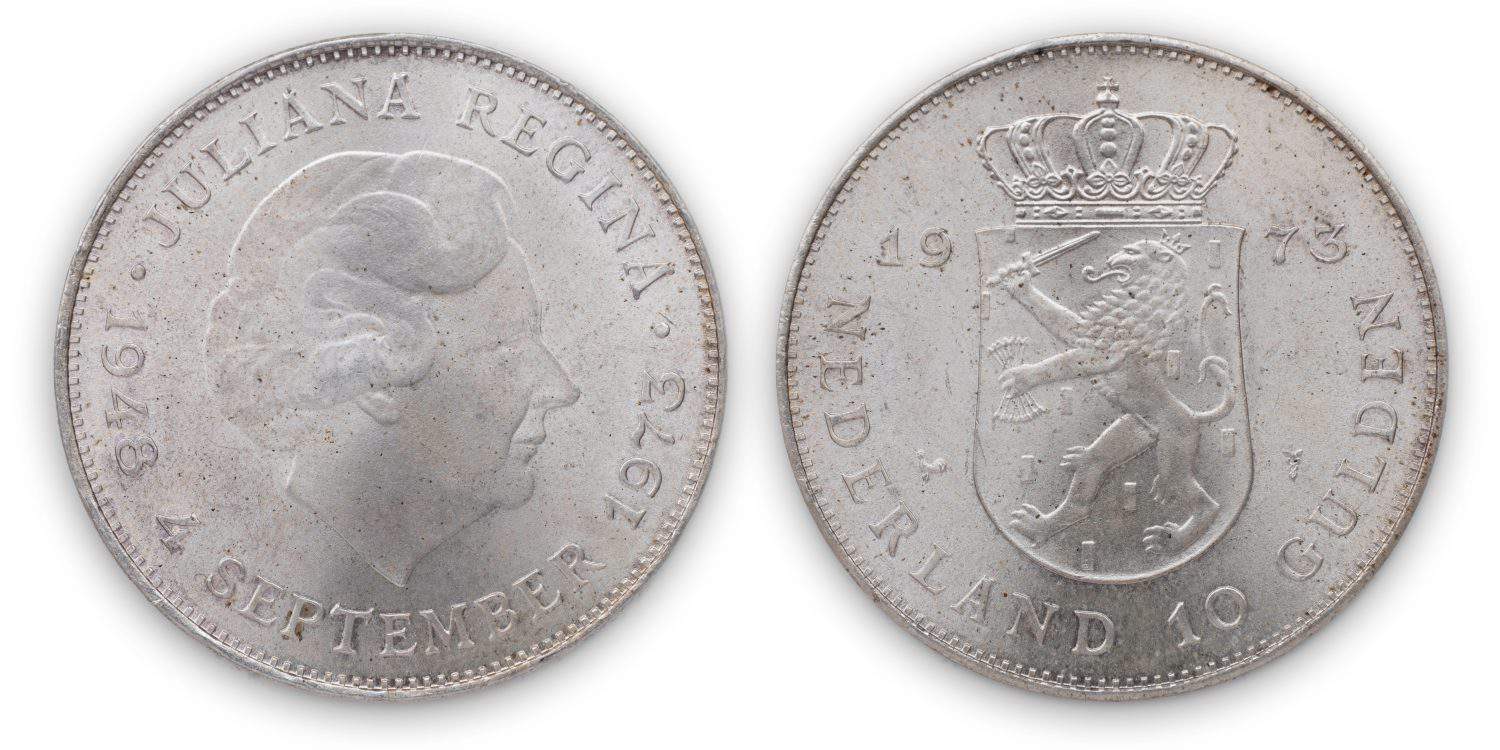Silver dutch coin Ten Guilder (10 gulden or 'Zilveren Tientje'), 1973, shield with lion with arrows and sword, crown on top, Queen Juliana head on obverse. Isolated on white