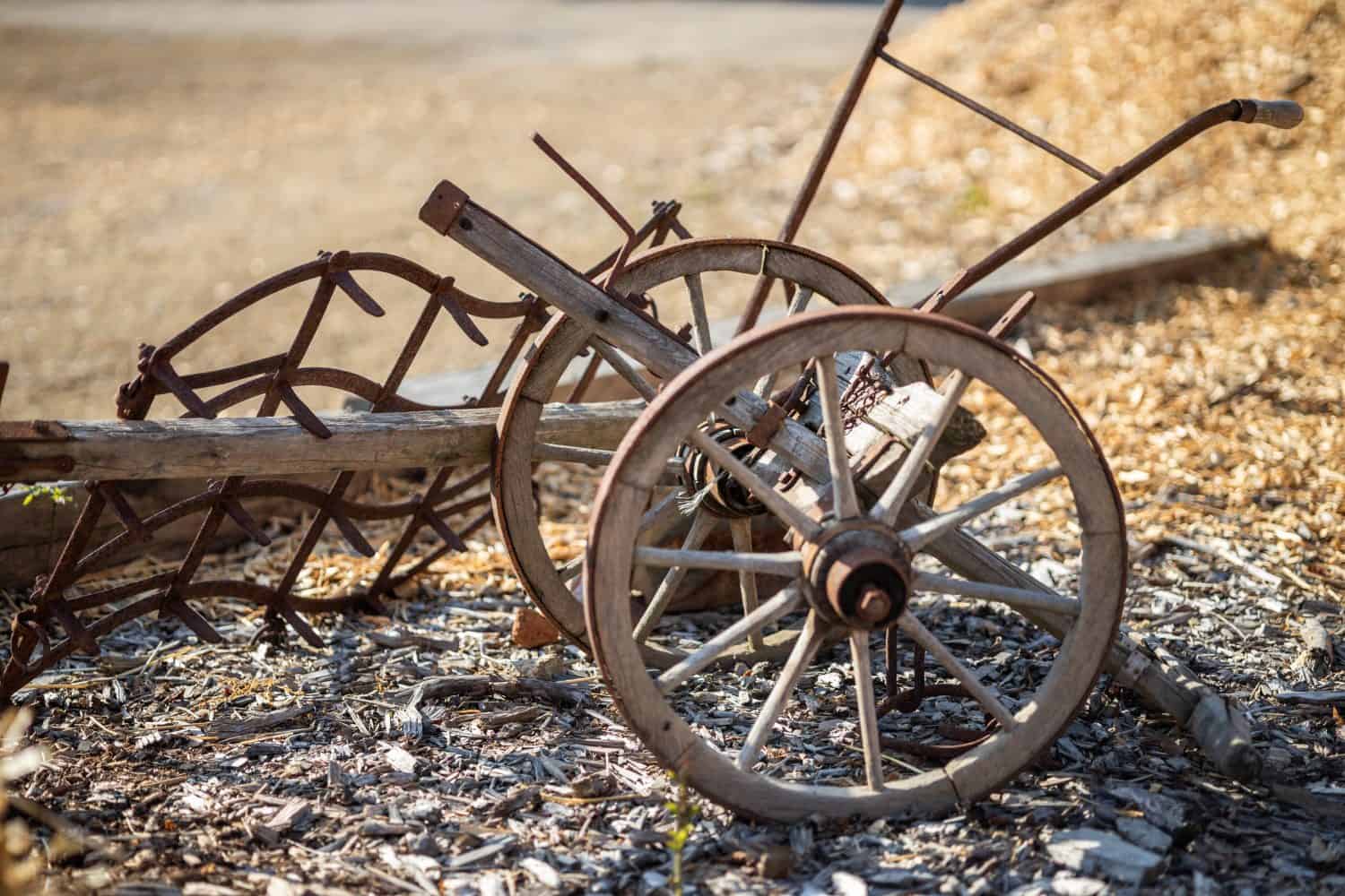 Vintage wood and steel plow on farm land