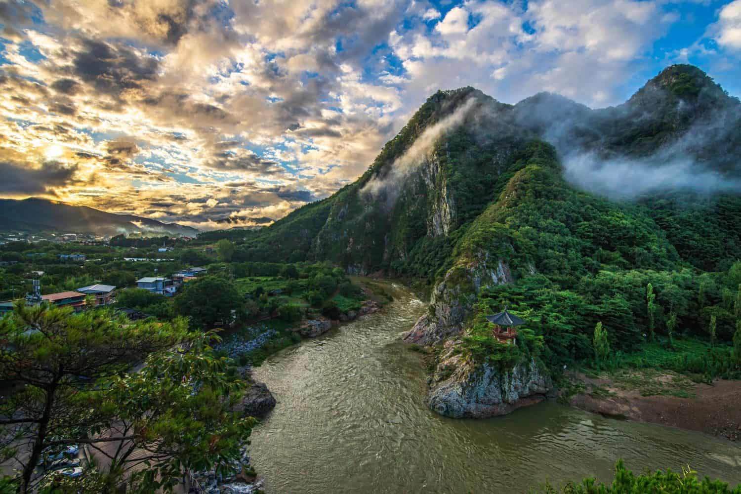 South Korea's natural landscape on Wollyu Bong Mountain in the morning, a landmark of North Chungcheong Province, rich in natural resources, with streams and ancient wooden pavilions covered with fore