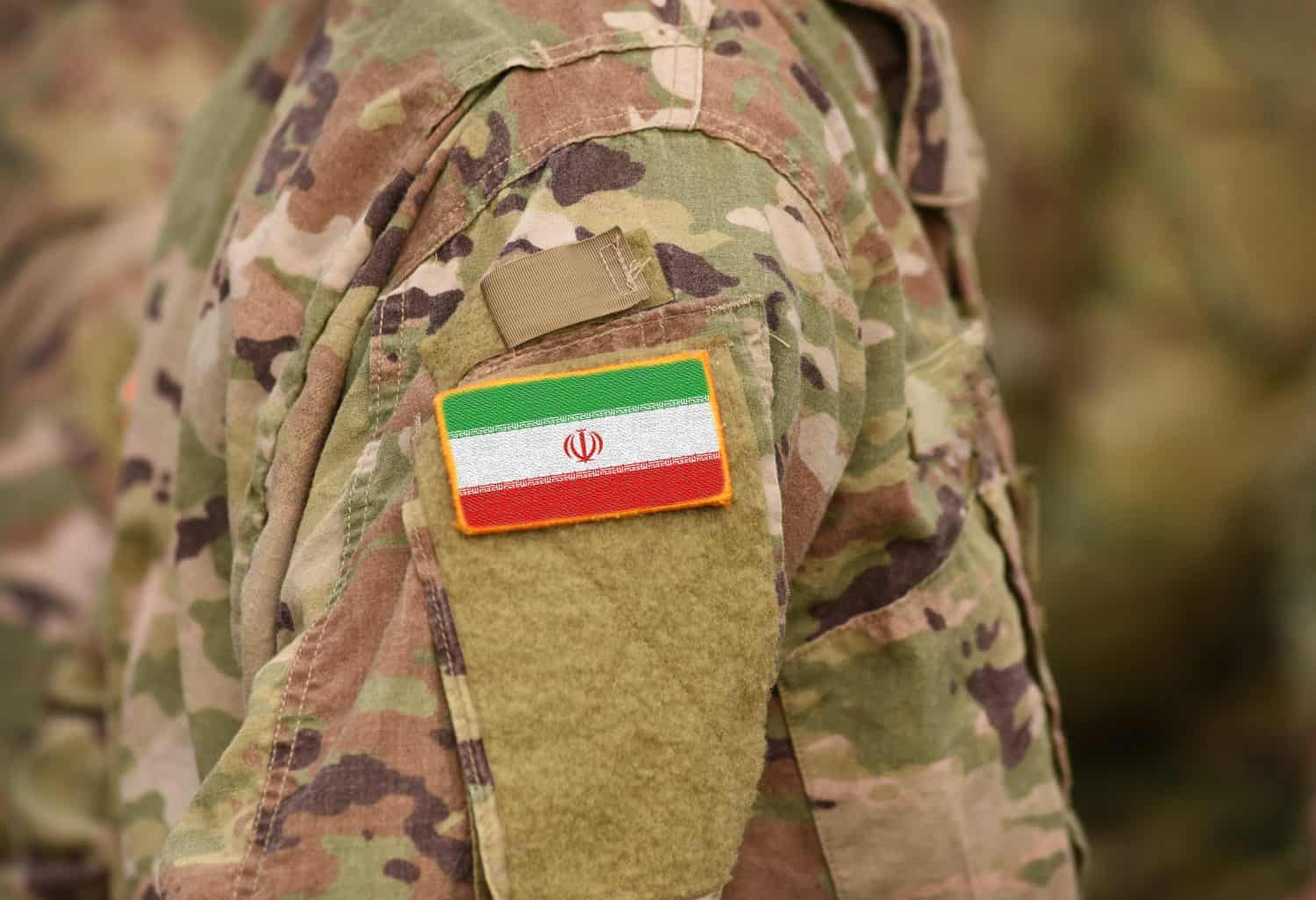 Flag of Iran on soldiers arm (collage).
