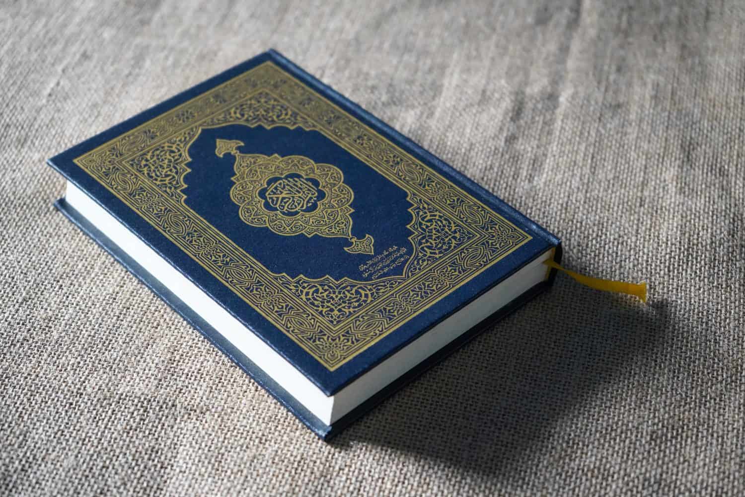 The Quran, also romanized Qur'an or Koran, is central religious text of Islam, believed by Muslims to be revelation from God (Allah). Classical Arabic. Sack, blue.