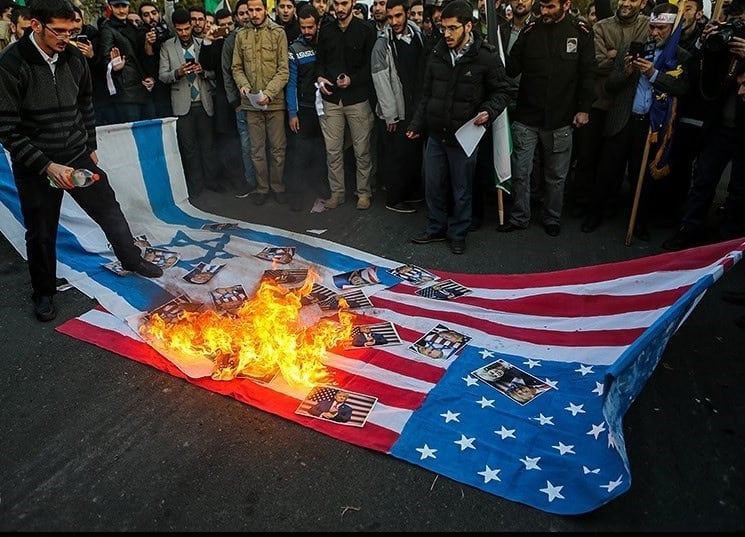 Burning Israeli and American flags in Iran