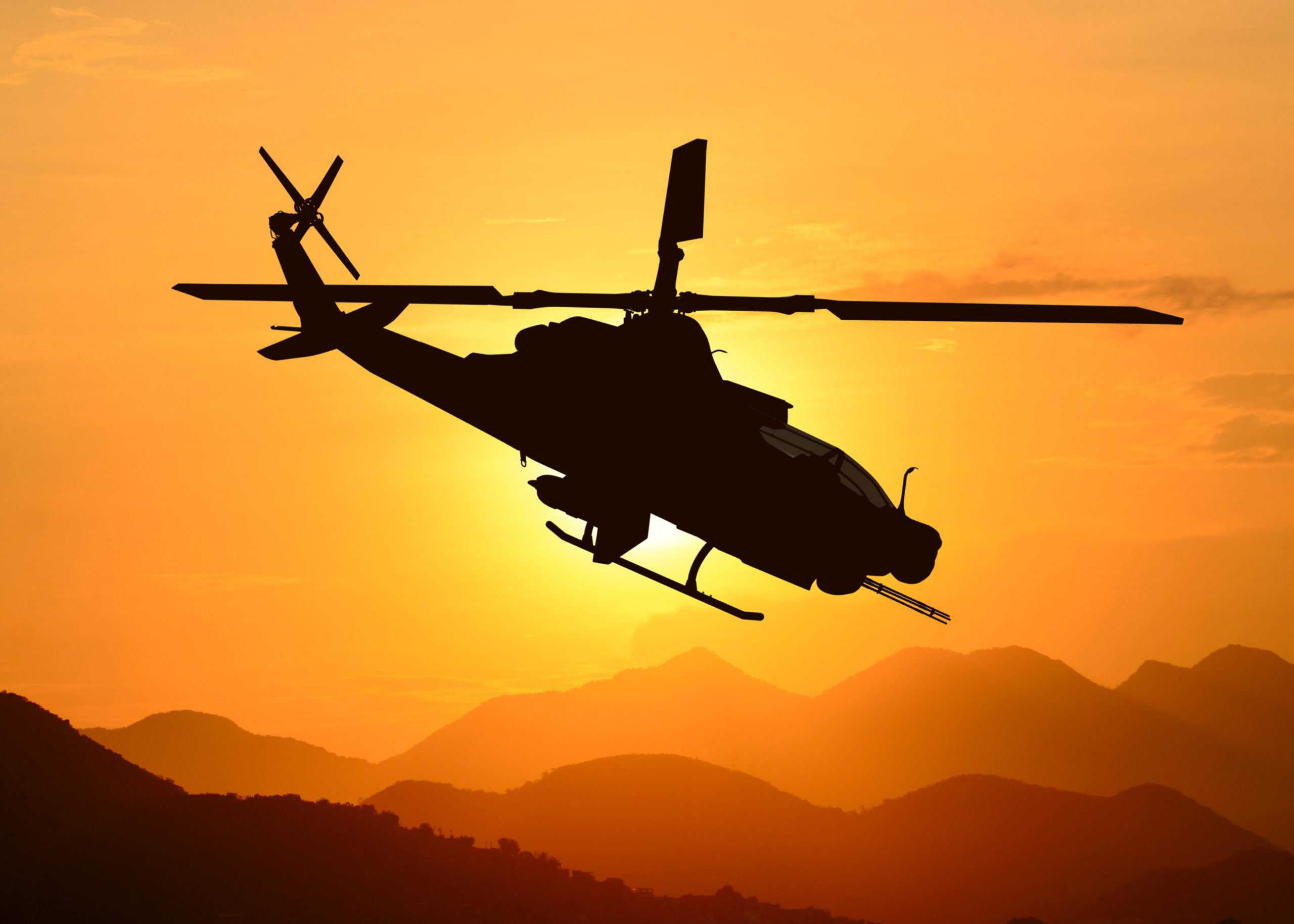 American attack helicopter silhouette in the flight