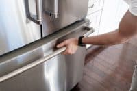 Man Opens Freezer Door