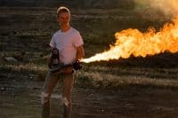 Young Man Operating a Flamethrower