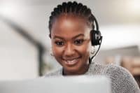 Black woman, reading and online in call center for telemarketing in outbound, tech support and customer service. Girl, virtual assistant and crm or faq with contact us for advice, headset and agent.