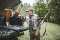 Hunter and dog preparing for hunt session.