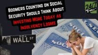 A composite image featuring a distressed woman with her head in her hands in front of blue Social Security cards, contrasted with a Wall Street sign. Overlaying the image is a black speech bubble with white and red text stating: "BOOMERS COUNTING ON SOCIAL SECURITY SHOULD THINK ABOUT INVESTING MORE TODAY AS INSOLVENCY LOOMS." A "24/7 WALL ST" logo is in the top right.