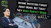 A serious-looking man with black hair and glasses, wearing a dark suit and striped shirt, stands with his arms crossed. In the foreground on the left, the '24/7 WALL ST' logo is visible. Behind him, a large black text box proclaims 'INCOME INVESTORS FORGOT ABOUT MUNIS, BUT TODAY THEY MAKE PERFECT SENSE', with 'MAKE PERFECT SENSE' in bright green. To the right, a black 'WALL ST' sign with '22-51' is prominent. Below, part of a 'FRANKLIN TEMPLETON INVESTMENTS' sign is visible. The background features blurred financial bar charts and modern glass buildings, giving a sense of the financial district.