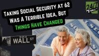 A vibrant image features an older man and woman, both with gray hair, smiling as they look at a laptop. The man, in an orange shirt, is on the left; the woman, in a lavender top, is on the right. In the background, partially visible, are blue-tinted financial documents, possibly Social Security statements, and a black 'WALL ST' street sign. A black, speech bubble-like overlay with white text reads 'TAKING SOCIAL SECURITY AT 62 WAS A TERRIBLE IDEA, BUT' and green text says 'THINGS HAVE CHANGED'. A '24/7 WALL ST' logo is in the top right corner.
