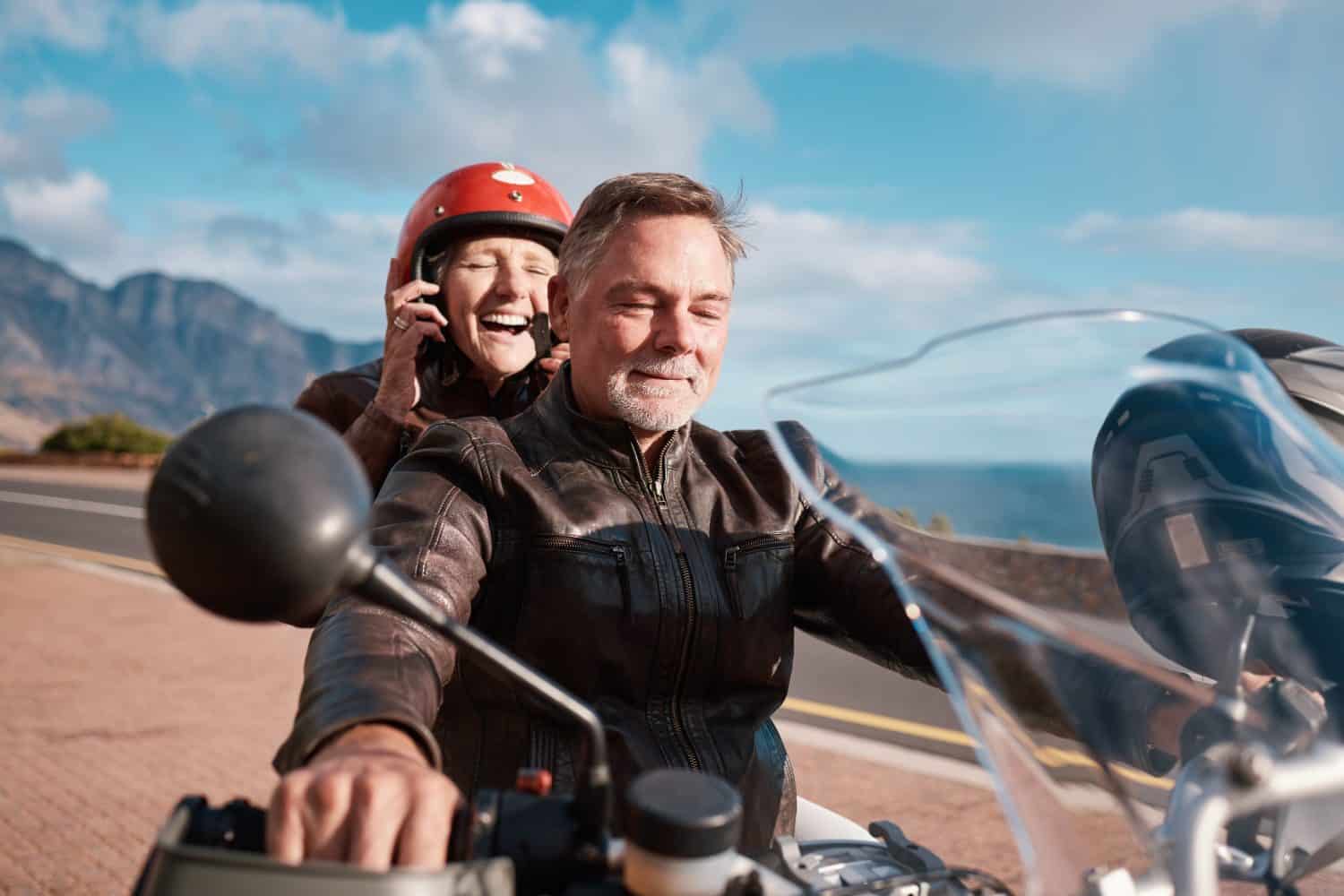 Travel, love and senior couple with motorbike, retirement and happiness for vacation, excited and cheerful. Freedom, old man and happy mature woman with motorcycle, transportation and quality time