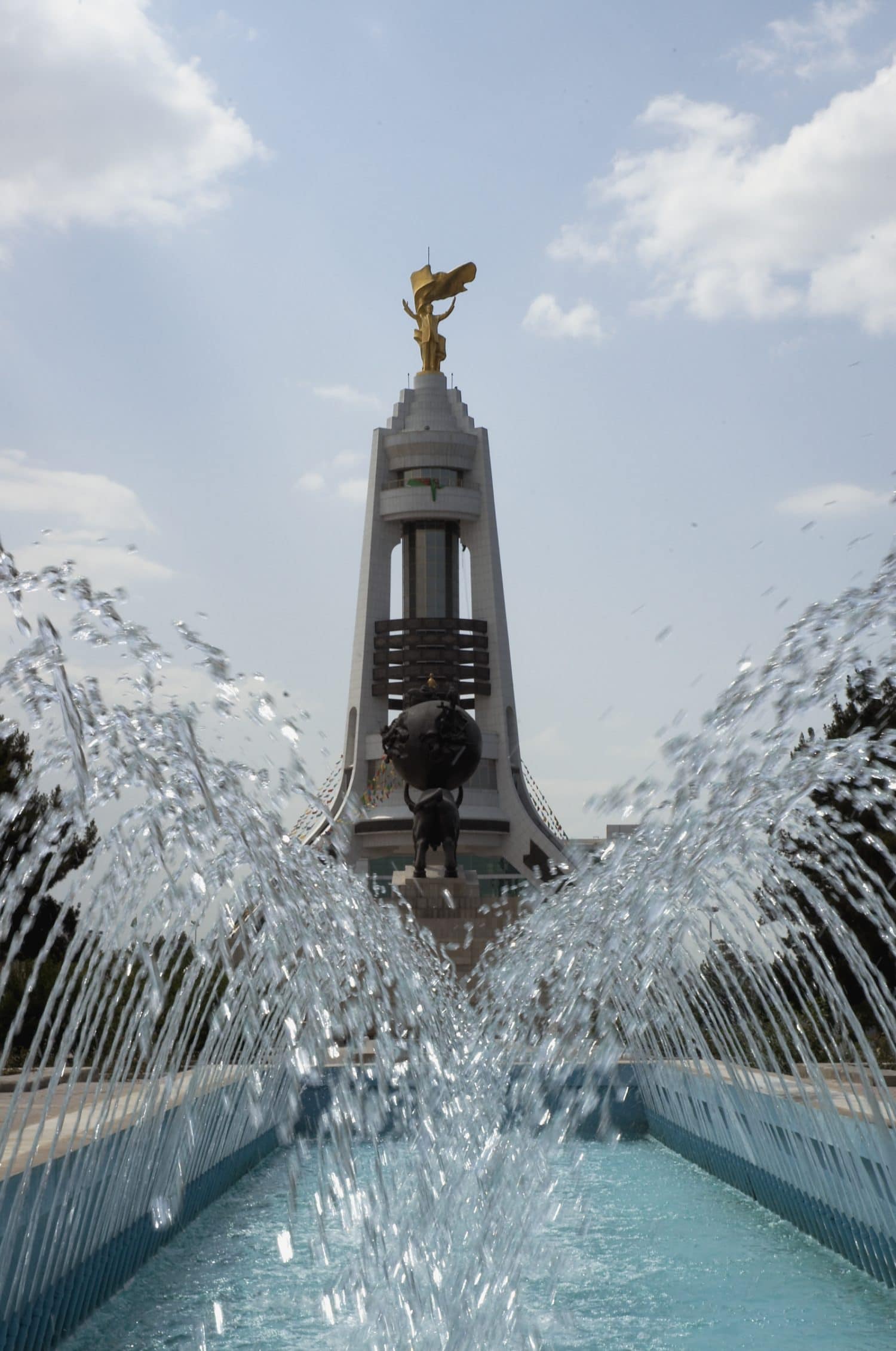 Arch of Neutrality monument with golden statue of Turkmen President on the top