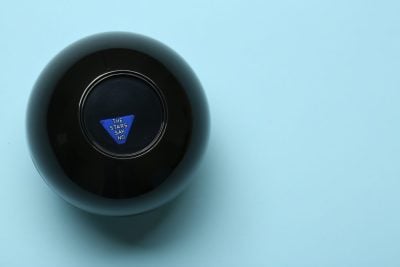 Magic eight ball with prediction The Stars Say No on light blue background, top view. Space for text