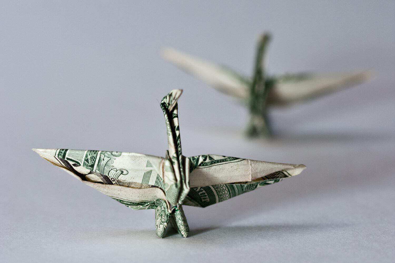 origami crane from a money note