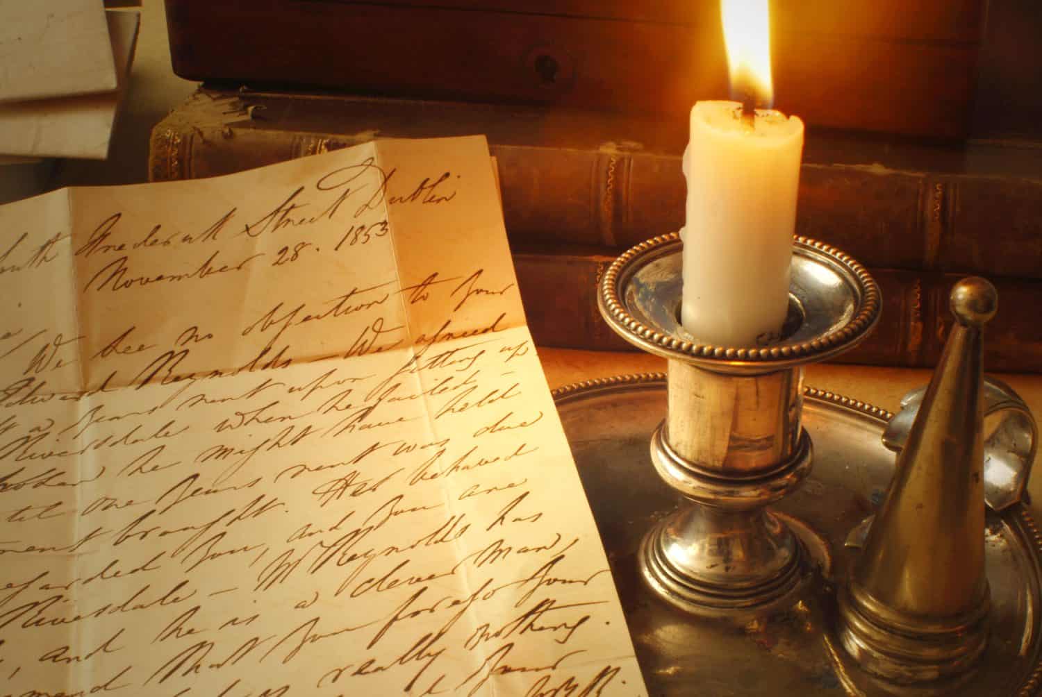 Reading a letter by candle light from 1800's