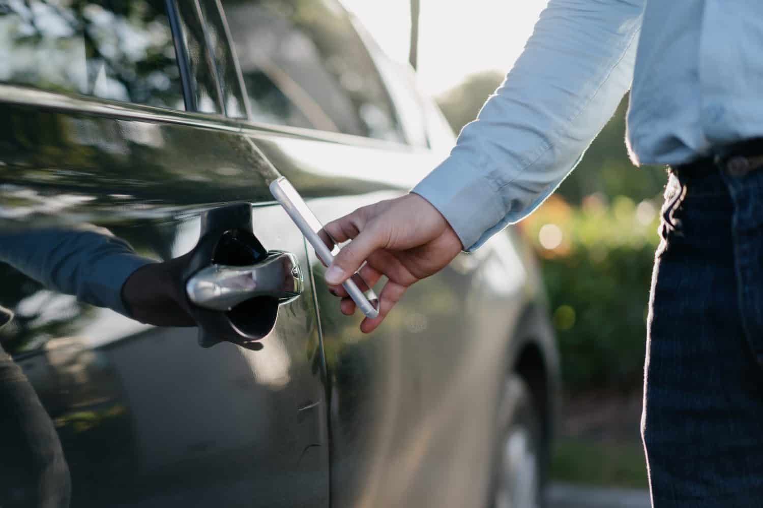 businessman unlock car with smartphone