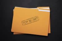 Yellow file with documents and Top Secret stamp on black table, top view