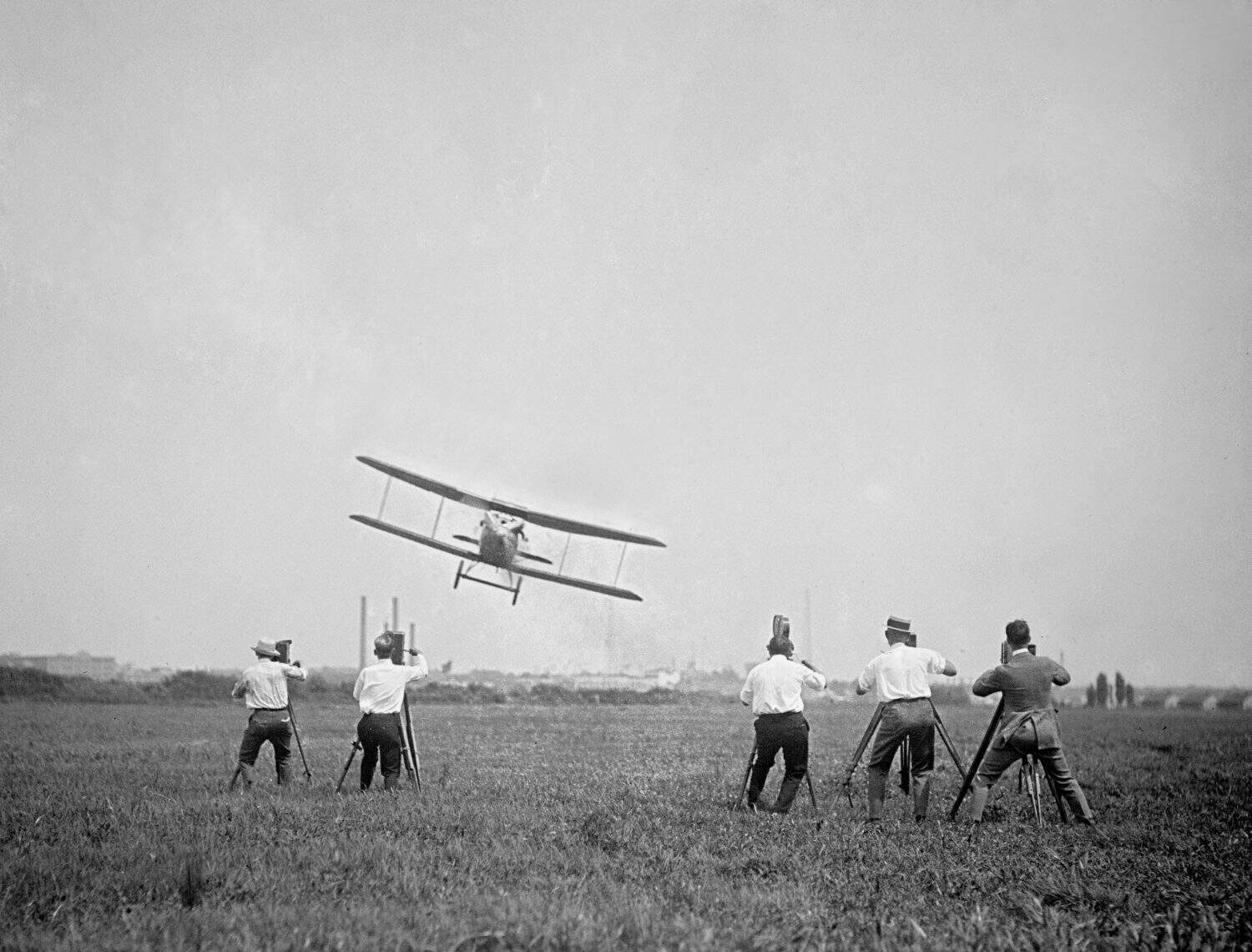 Four motion picture photographers record a naval sea plane buzzing them in 1927 near Washington, D.C.