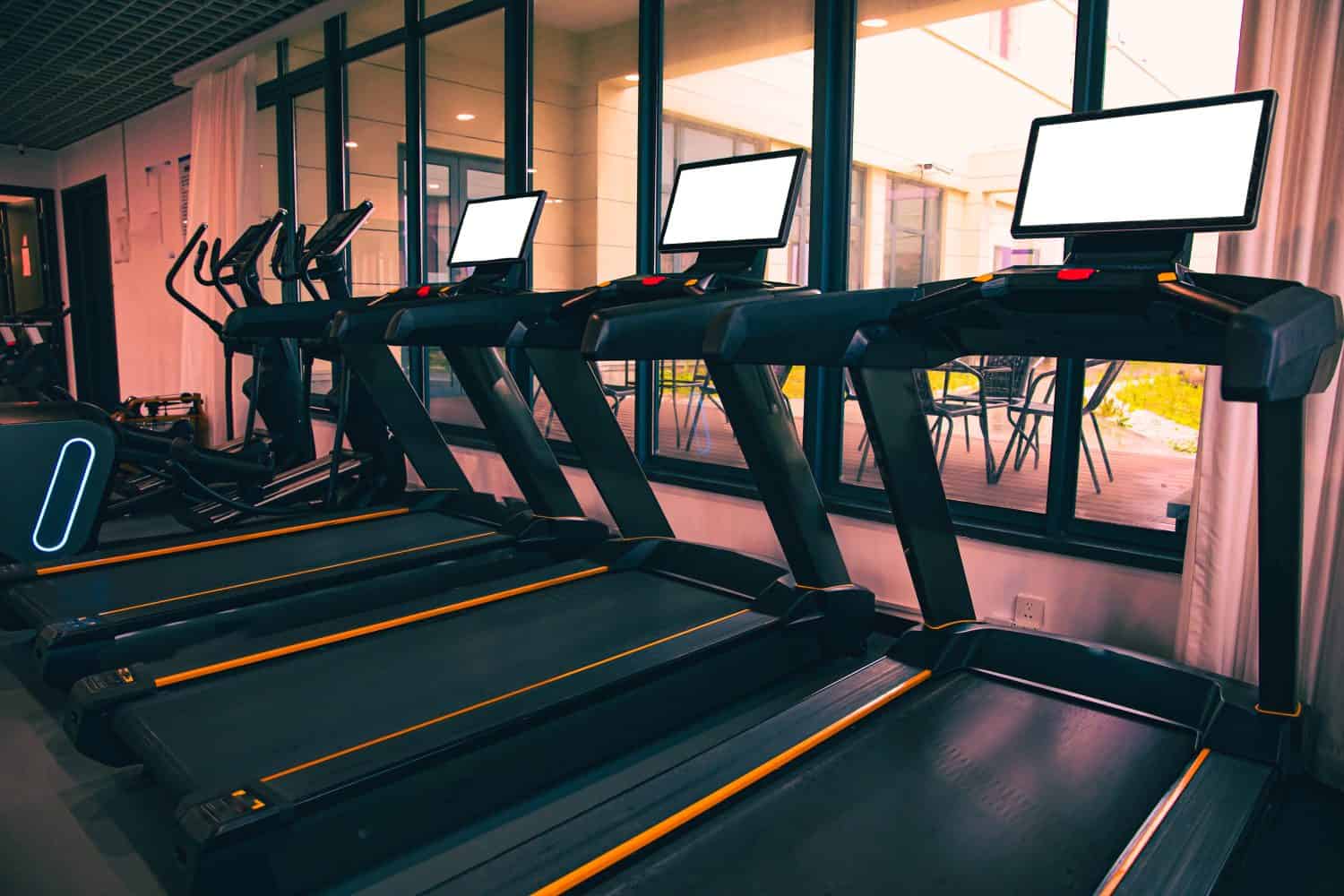 Treadmills with white screen for runners in a Gym for workout and indoor run and walk