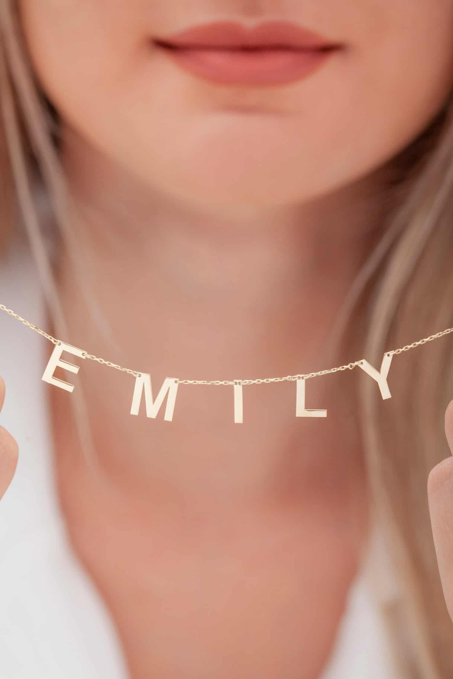 Silver Necklace Photo. Name necklace on the lady in white clothes. Jewelry photography for e-commerce, social media and all platforms.