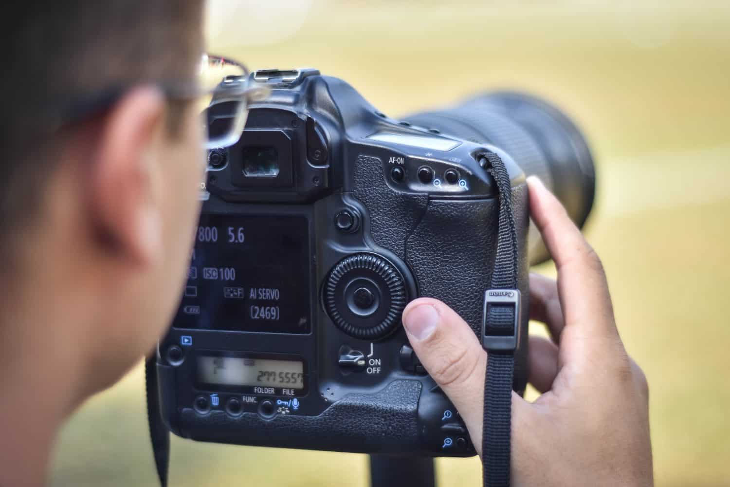 Photographer working photographing sports on football field