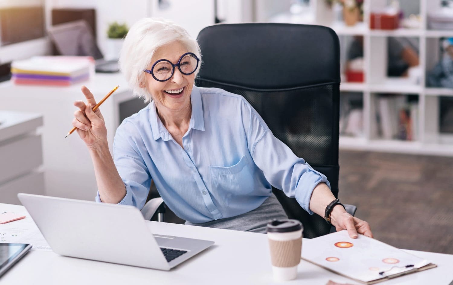 Laughing aged woman enjoying her job