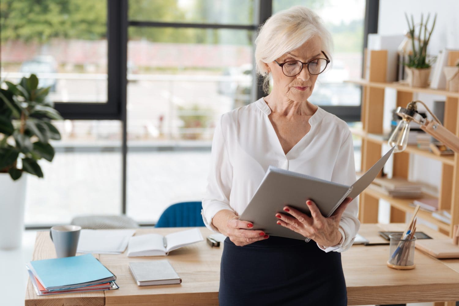 Professional hard working businesswoman reading a report