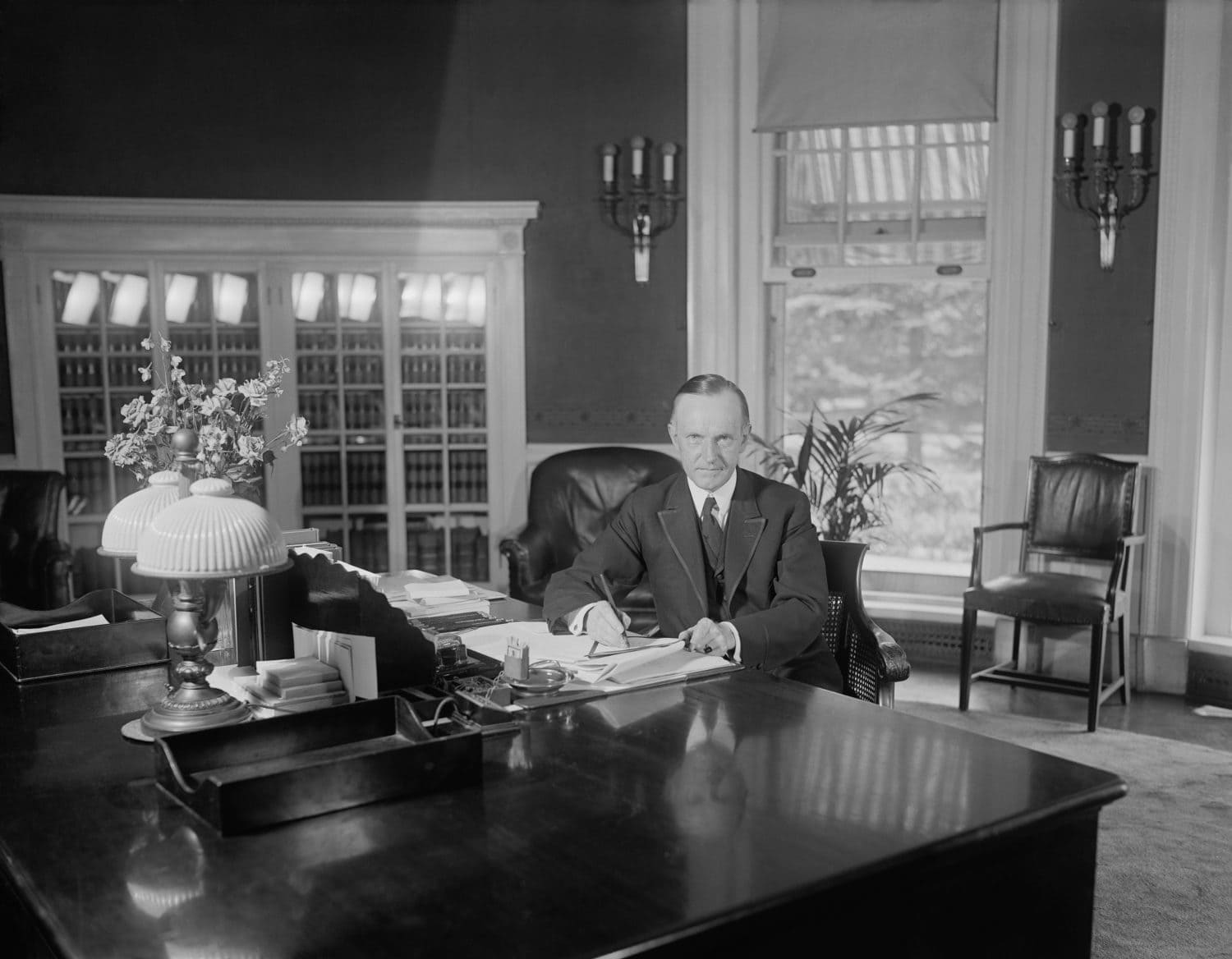 President Calvin Coolidge at the same desk used by Harding in the Oval Office. Photo was published on Aug. 14, 1923, less than two weeks after the death of Warren Harding. Florence Harding was upset t