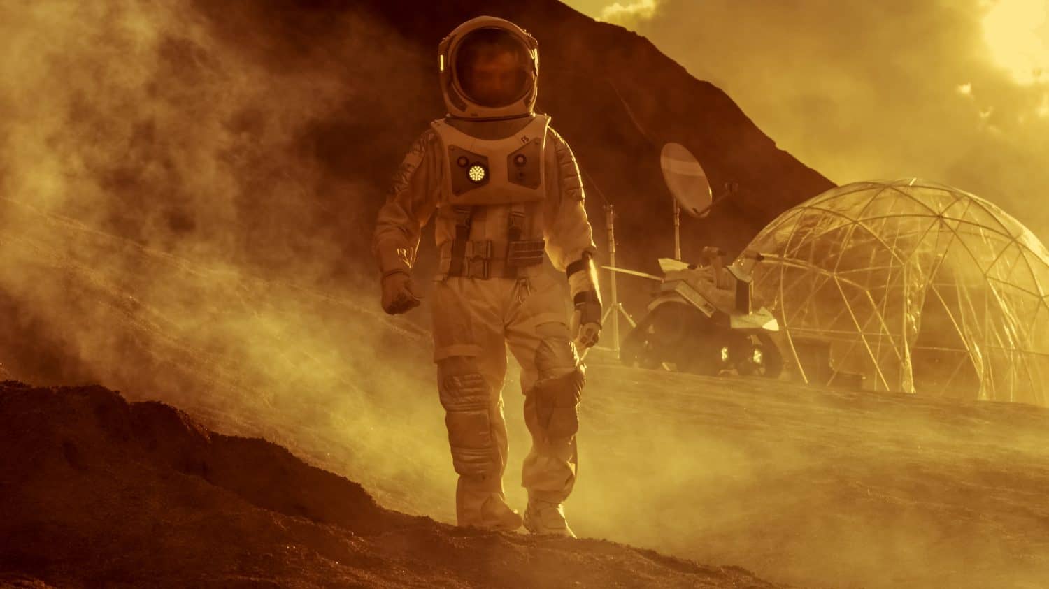 Astronaut on Mars Walking on the Exploring Expedition. In the Background His Base/ Research Station. First Manned Mission To Mars, Technological Advance Brings Space Exploration, Colonization.