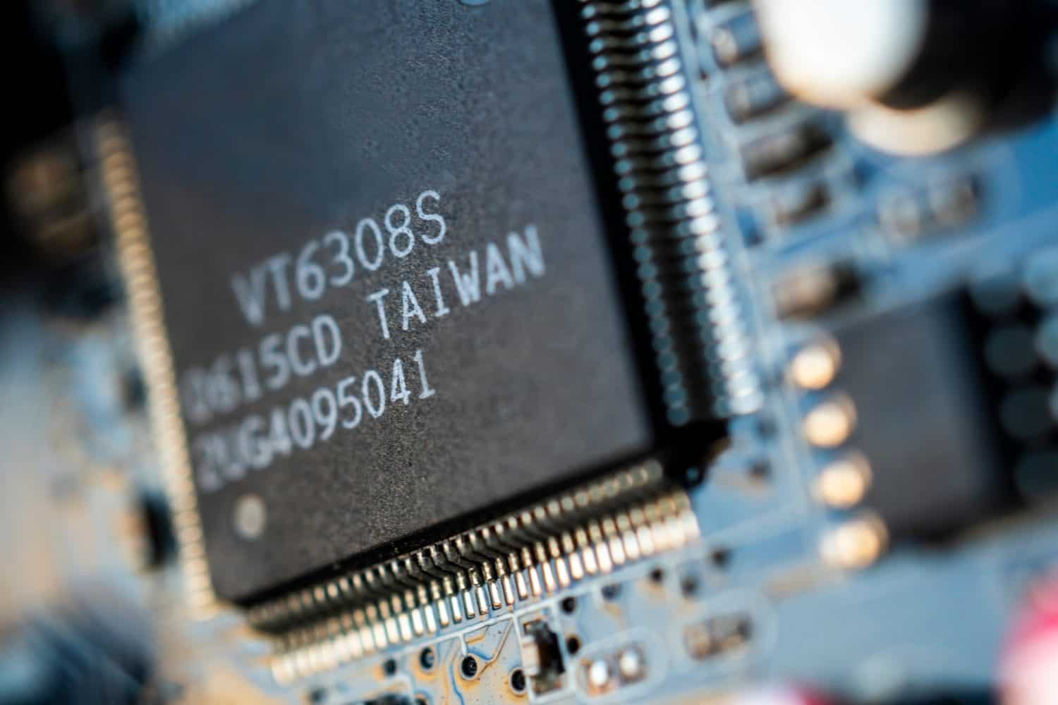 Close up Macro shooting of computer main board or circuit board's integrated elements. Made in Taiwan, Science and Technology concept. Shallow depth of field and copy space.