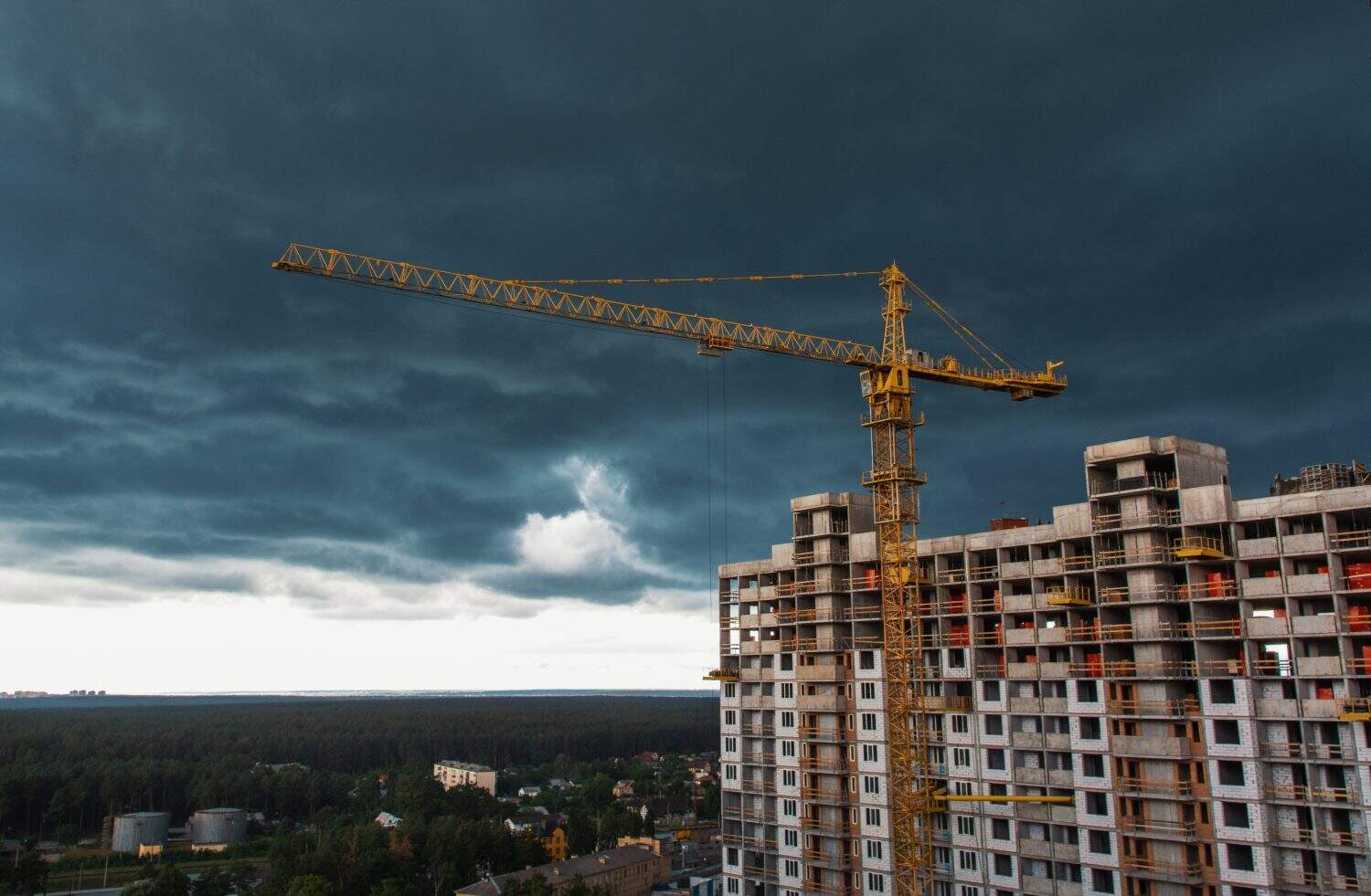 empty apartment house high rise building construction background - crisis in real estate property sector. Grunge image filter