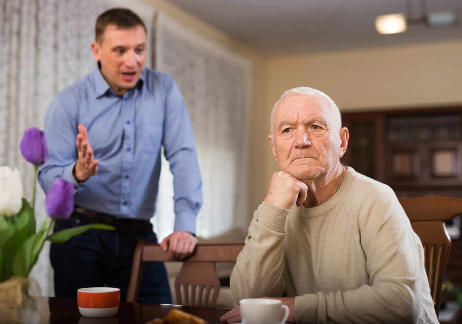 Adult son dissatisfied with his father, chastises him at home