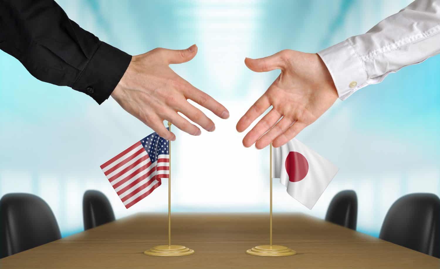 United States and Japan diplomats agreeing on a deal