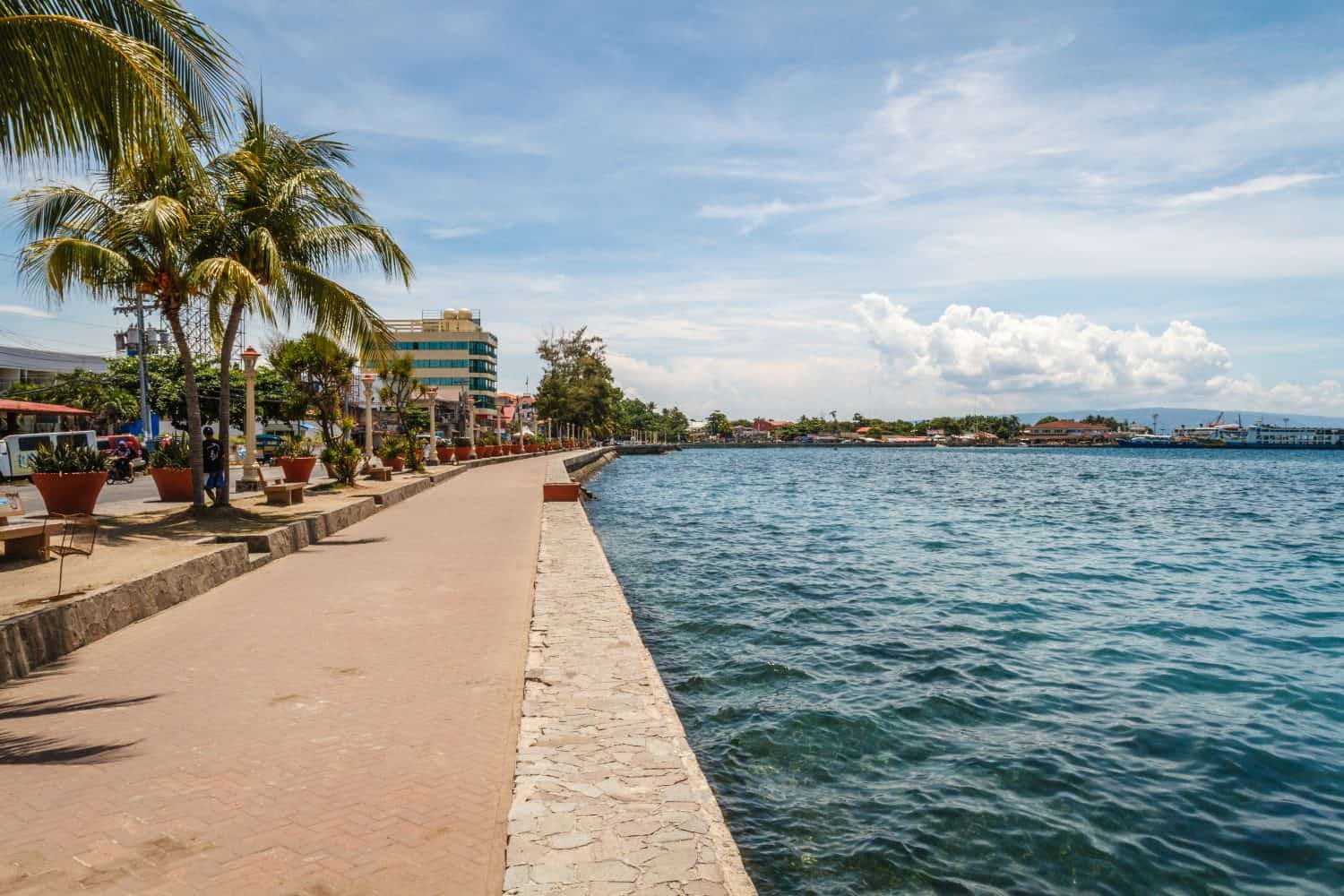 The promenade along Rizal Boulevard with trees and sea view, City of Dumaguete, Negros Oriental, Philippines